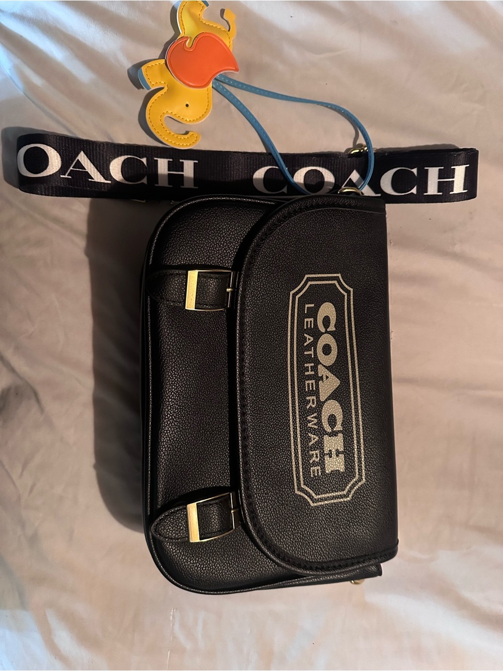Coach Black Leather Crossbody Belt Bag with Logo Strap and Yellow Charm